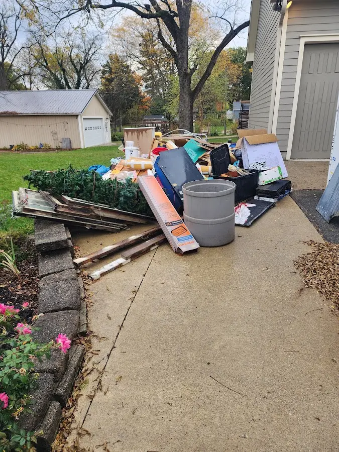 Dumpster being loaded with debris for Residential Dumpster Rental in Fall River
